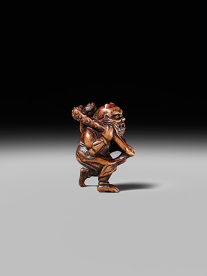 Lot 153 - A VERY RARE WOOD NETSUKE OF AN ONI CAUGHT IN A SPIDERWEB