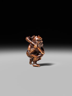 Lot 153 - A VERY RARE WOOD NETSUKE OF AN ONI CAUGHT IN A SPIDERWEB