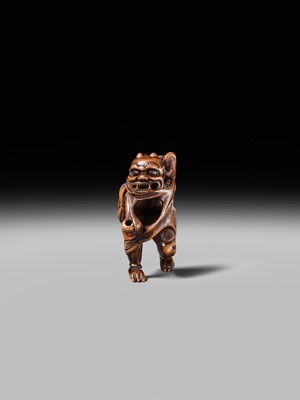 Lot 153 - A VERY RARE WOOD NETSUKE OF AN ONI CAUGHT IN A SPIDERWEB