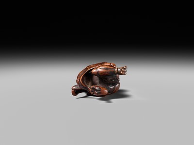 Lot 153 - A VERY RARE WOOD NETSUKE OF AN ONI CAUGHT IN A SPIDERWEB