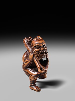 Lot 153 - A VERY RARE WOOD NETSUKE OF AN ONI CAUGHT IN A SPIDERWEB