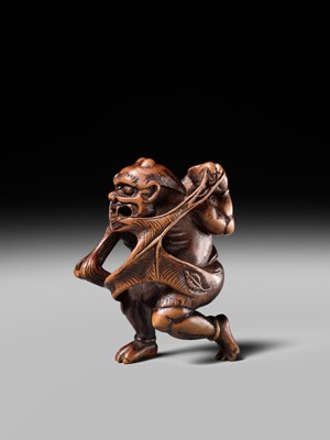 Lot 153 - A VERY RARE WOOD NETSUKE OF AN ONI CAUGHT IN A SPIDERWEB