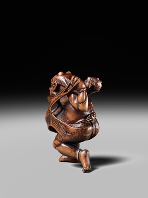 Lot 153 - A VERY RARE WOOD NETSUKE OF AN ONI CAUGHT IN A SPIDERWEB