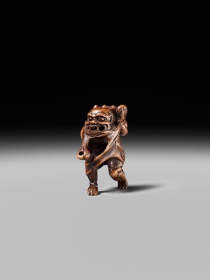 Lot 153 - A VERY RARE WOOD NETSUKE OF AN ONI CAUGHT IN A SPIDERWEB