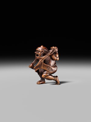 Lot 153 - A VERY RARE WOOD NETSUKE OF AN ONI CAUGHT IN A SPIDERWEB