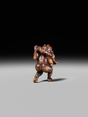 Lot 153 - A VERY RARE WOOD NETSUKE OF AN ONI CAUGHT IN A SPIDERWEB