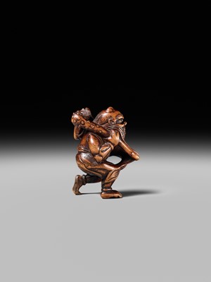 Lot 153 - A VERY RARE WOOD NETSUKE OF AN ONI CAUGHT IN A SPIDERWEB