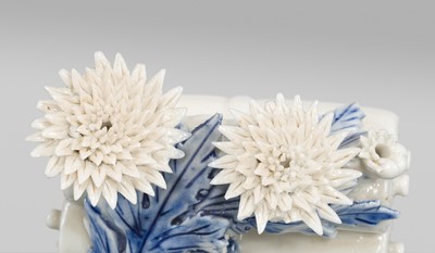 Lot 93 - A FINE HIRADO PORCELAIN ‘SCROLL WITH KIKU (CHRYSANTHEMUM) BLOSSOMS’ SUITEKI (WATER DROPPER)