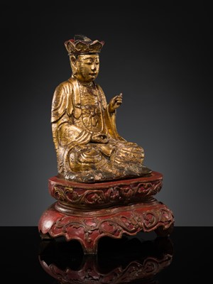 Lot 404 - A GILT-LACQUER WOOD FIGURE OF BUDDHA, VIETNAM, 17TH-18TH CENTURY