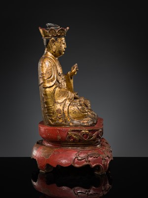 Lot 404 - A GILT-LACQUER WOOD FIGURE OF BUDDHA, VIETNAM, 17TH-18TH CENTURY