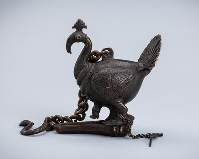 A BRONZE HANGING OIL LAMP IN THE FORM OF A PEACOCK