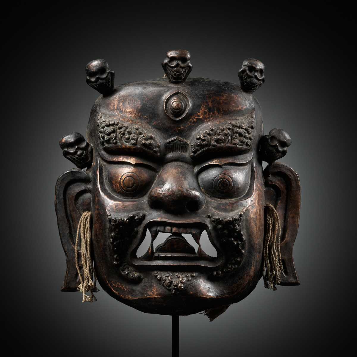 Lot 11 - A COPPER REPOUSSÉ RITUAL MASK OF MAHAKALA, 19TH CENTURY