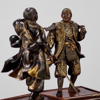 Lot 146 - MIYAO: A SUPERB PAIR OF PARCEL-GILT BRONZE FIGURES OF SAMURAI