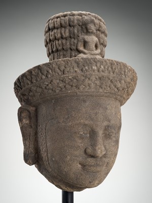 Lot 973 - A SANDSTONE HEAD OF VISHNU, ANGKOR PERIOD, 10TH - 12TH CENTURY