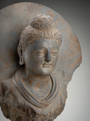 Lot 1240 - A GRAY SCHIST BUST OF BUDDHA, GANDHARA, 1ST - 5TH CENTURY AD OR LATER