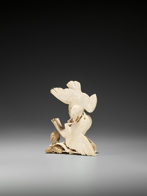Lot 238 - EISHIN: A FINE IVORY OKIMONO OF TWO QUAILS FIGHTING OVER MILLET