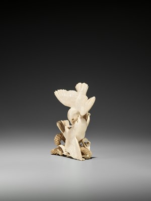 Lot 238 - EISHIN: A FINE IVORY OKIMONO OF TWO QUAILS FIGHTING OVER MILLET
