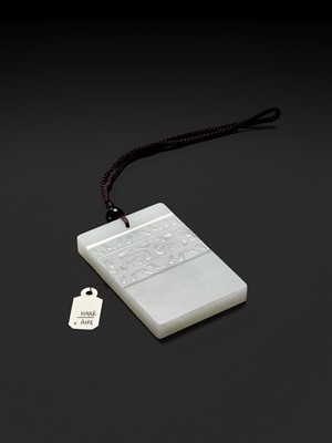 Lot 466 - A WHITE JADE ‘TAOTIE’ PENDANT, 19TH CENTURY