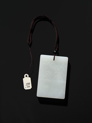 Lot 466 - A WHITE JADE ‘TAOTIE’ PENDANT, 19TH CENTURY