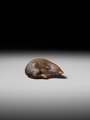 Lot 140 - TAMETAKA: A SUPERB WOOD NETSUKE OF A BOAR RESTING ON AUTUMN LEAVES