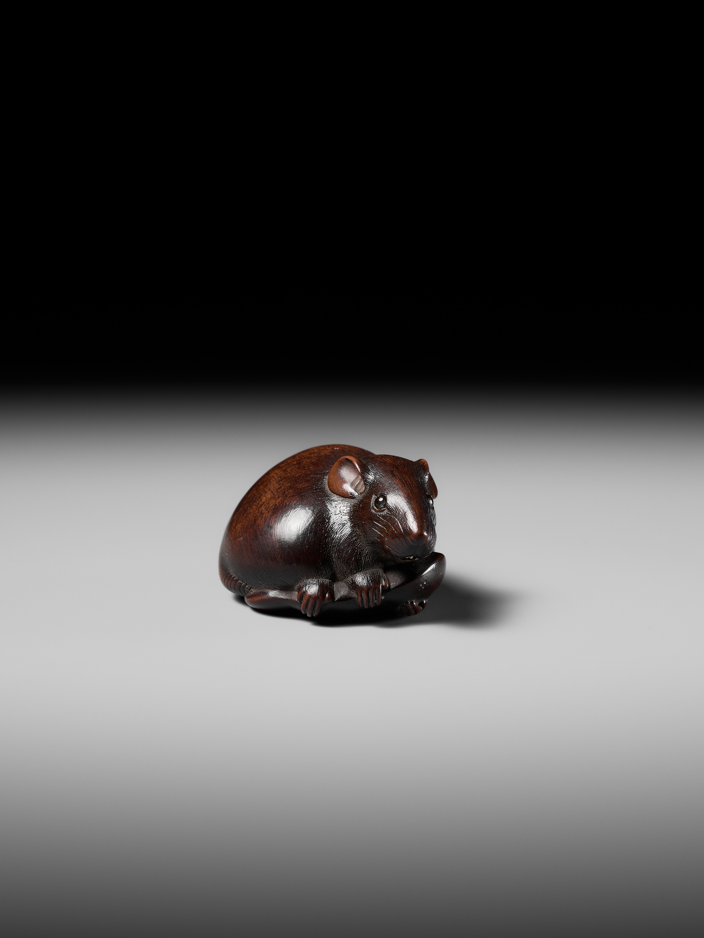 Lot 147 - KANO TOMOKAZU: A SUPERB WOOD NETSUKE OF A