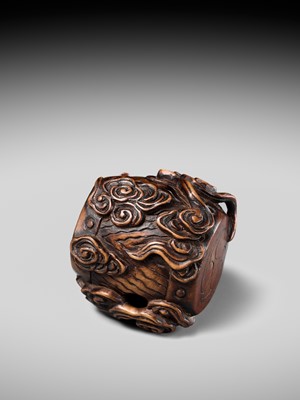 Lot 152 - A FINE NAGOYA SCHOOL WOOD NETSUKE OF RAIJIN SLEEPING ON HIS THUNDER DRUM