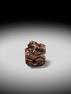 Lot 152 - A FINE NAGOYA SCHOOL WOOD NETSUKE OF RAIJIN SLEEPING ON HIS THUNDER DRUM