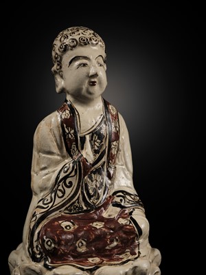 Lot 145 - A RARE AND LARGE CIZHOU POLYCHROME POTTERY FIGURE OF BUDDHA, JIN DYNASTY