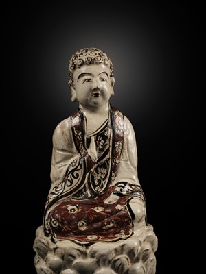 Lot 145 - A RARE AND LARGE CIZHOU POLYCHROME POTTERY FIGURE OF BUDDHA, JIN DYNASTY