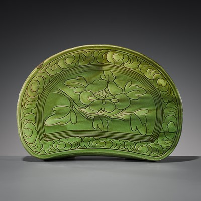 Lot 550 - A GREEN-GLAZED CIZHOU ‘PEONY’ PILLOW, JIN DYNASTY