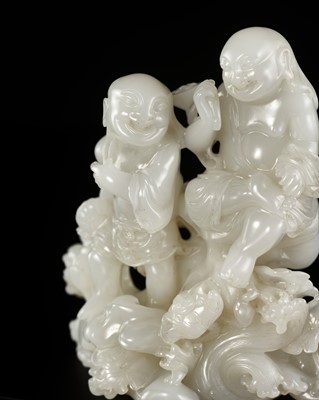 Lot 106 - A FINE AND RARE WHITE JADE ‘HEHE ERXIAN’ GROUP, 18TH CENTURY