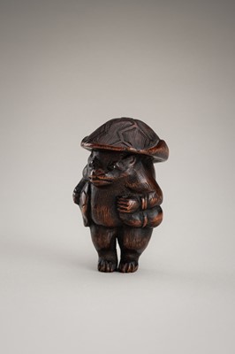 Lot 462 - A WOOD NETSUKE OF A TANUKI DISGUISED AS A SAKE VENDOR