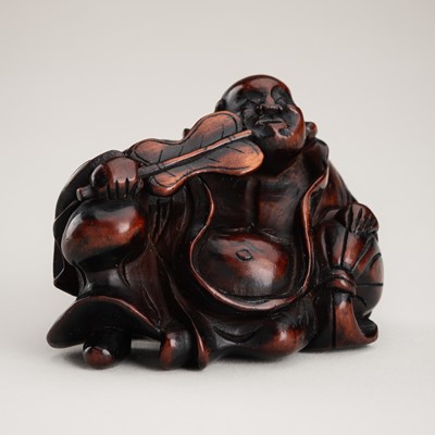 Lot 466 - A LARGE WOOD KARAKURI (TRICK) NETSUKE OF HOTEI WITH HIS TREASURE BAG