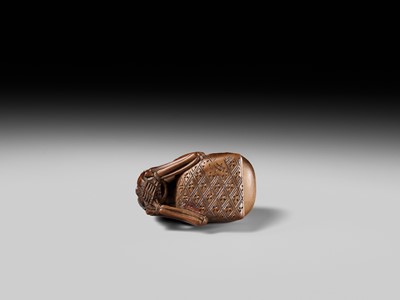 Lot 468 - TOMOKAZU: A WOOD NETSUKE OF A SKELETON AND MOKUGYO