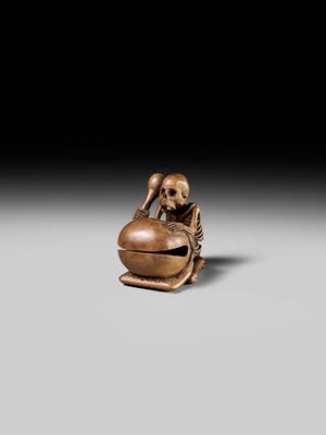 Lot 468 - TOMOKAZU: A WOOD NETSUKE OF A SKELETON AND MOKUGYO
