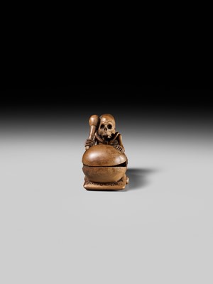 Lot 468 - TOMOKAZU: A WOOD NETSUKE OF A SKELETON AND MOKUGYO