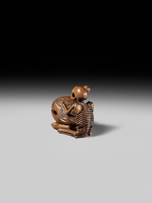 Lot 468 - TOMOKAZU: A WOOD NETSUKE OF A SKELETON AND MOKUGYO