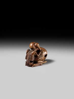 Lot 468 - TOMOKAZU: A WOOD NETSUKE OF A SKELETON AND MOKUGYO