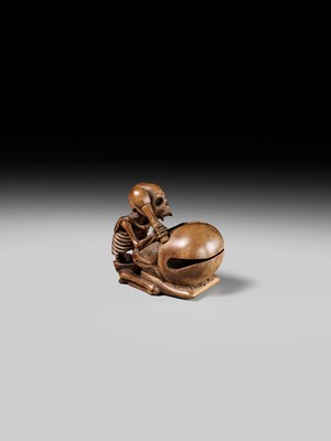Lot 468 - TOMOKAZU: A WOOD NETSUKE OF A SKELETON AND MOKUGYO