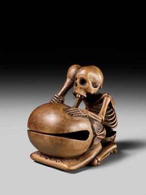 Lot 468 - TOMOKAZU: A WOOD NETSUKE OF A SKELETON AND MOKUGYO