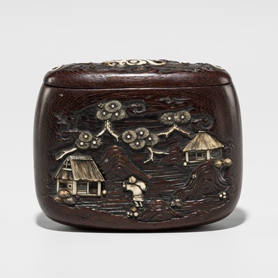 Lot 392 - KEISAI: A FINE ANTLER-INLAID WOOD TONKOTSU WITH IDYLLIC LANDSCAPE