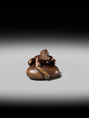 Lot 188 - SHOKO: A SUPERB WOOD NETSUKE OF A BLIND MAN LIFTING A CHIKARAISHI