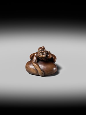 Lot 188 - SHOKO: A SUPERB WOOD NETSUKE OF A BLIND MAN LIFTING A CHIKARAISHI