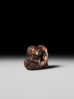 Lot 480 - TOMOHARU: A LARGE AND POWERFUL WOOD NETSUKE OF TWO SHISHI