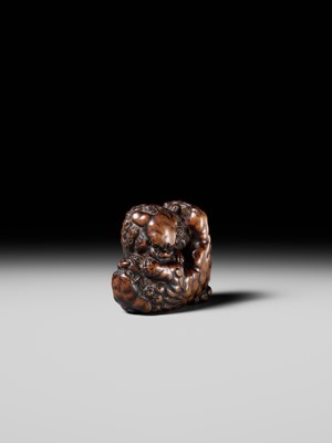 Lot 480 - TOMOHARU: A LARGE AND POWERFUL WOOD NETSUKE OF TWO SHISHI