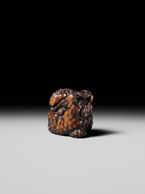 Lot 480 - TOMOHARU: A LARGE AND POWERFUL WOOD NETSUKE OF TWO SHISHI