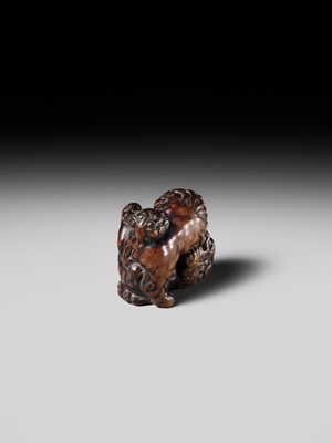 Lot 480 - TOMOHARU: A LARGE AND POWERFUL WOOD NETSUKE OF TWO SHISHI