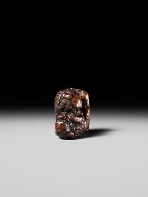 Lot 480 - TOMOHARU: A LARGE AND POWERFUL WOOD NETSUKE OF TWO SHISHI