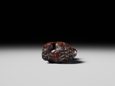 Lot 480 - TOMOHARU: A LARGE AND POWERFUL WOOD NETSUKE OF TWO SHISHI