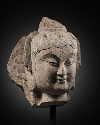 Lot 334 - A LIMESTONE HEAD OF A BODHISATVVA, QINGZHOU STYLE, EASTERN WEI DYNASTY, 6TH CENTURY